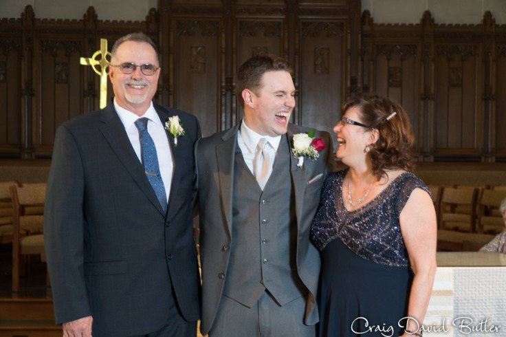 Fun photo of the groom and his parents
