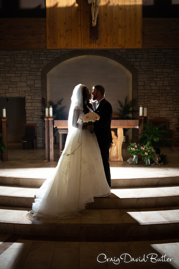 Backflash photo of the bride and groom at Holy Family in Novi MI